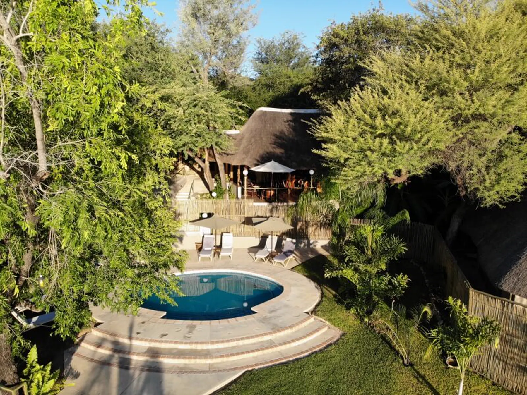 The pool and thatched lapa from the air
